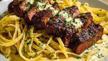 Cajun Garlic Butter Steak over Creamy Parmesan Linguine